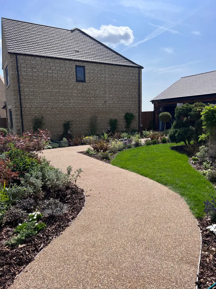 Resin bound driveway with landscaping and lawn