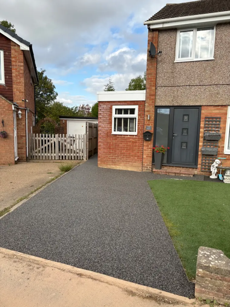 Resin bound driveway with artificial grass border